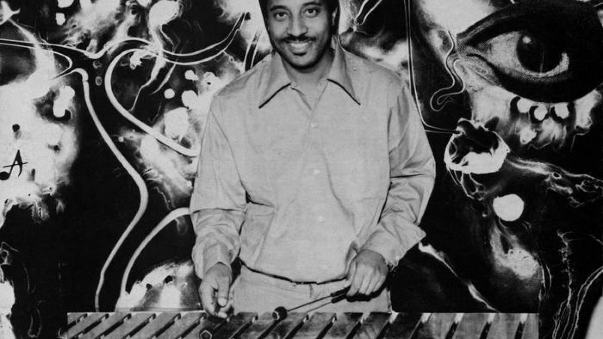 Cover for Mulatu of Ethiopia. A composite of a black and white photograph of Mulatu on top of a psychedelic background.