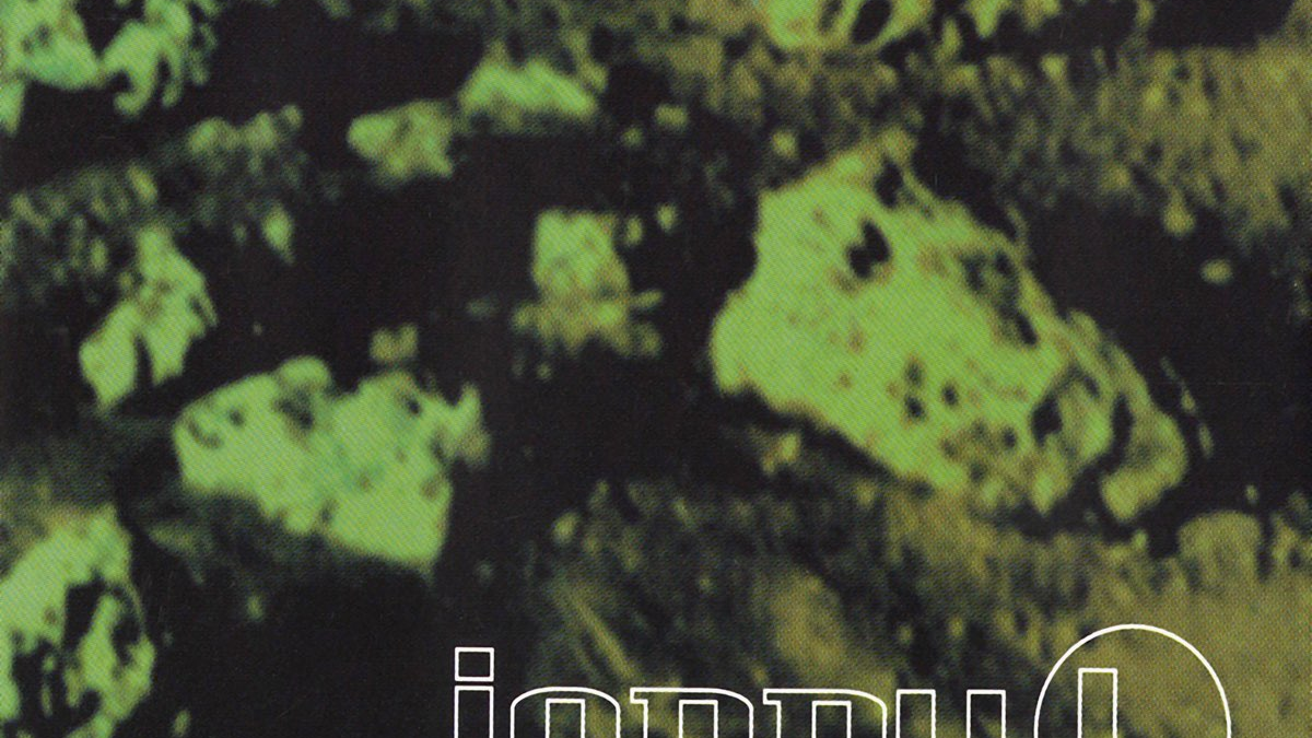 Cover for Johnny L's Piper on XL Records. A distorted image of rocks with a green filter.
